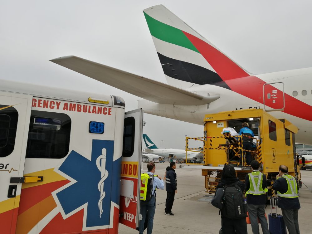 Medical Repatriation Ambulance near a plane, on the runway