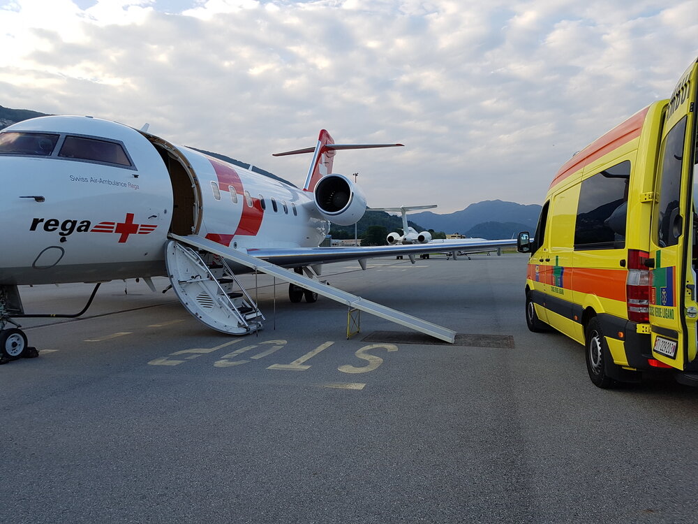 Hospitals in Europe international medical transportation. Ambulance next to plane.